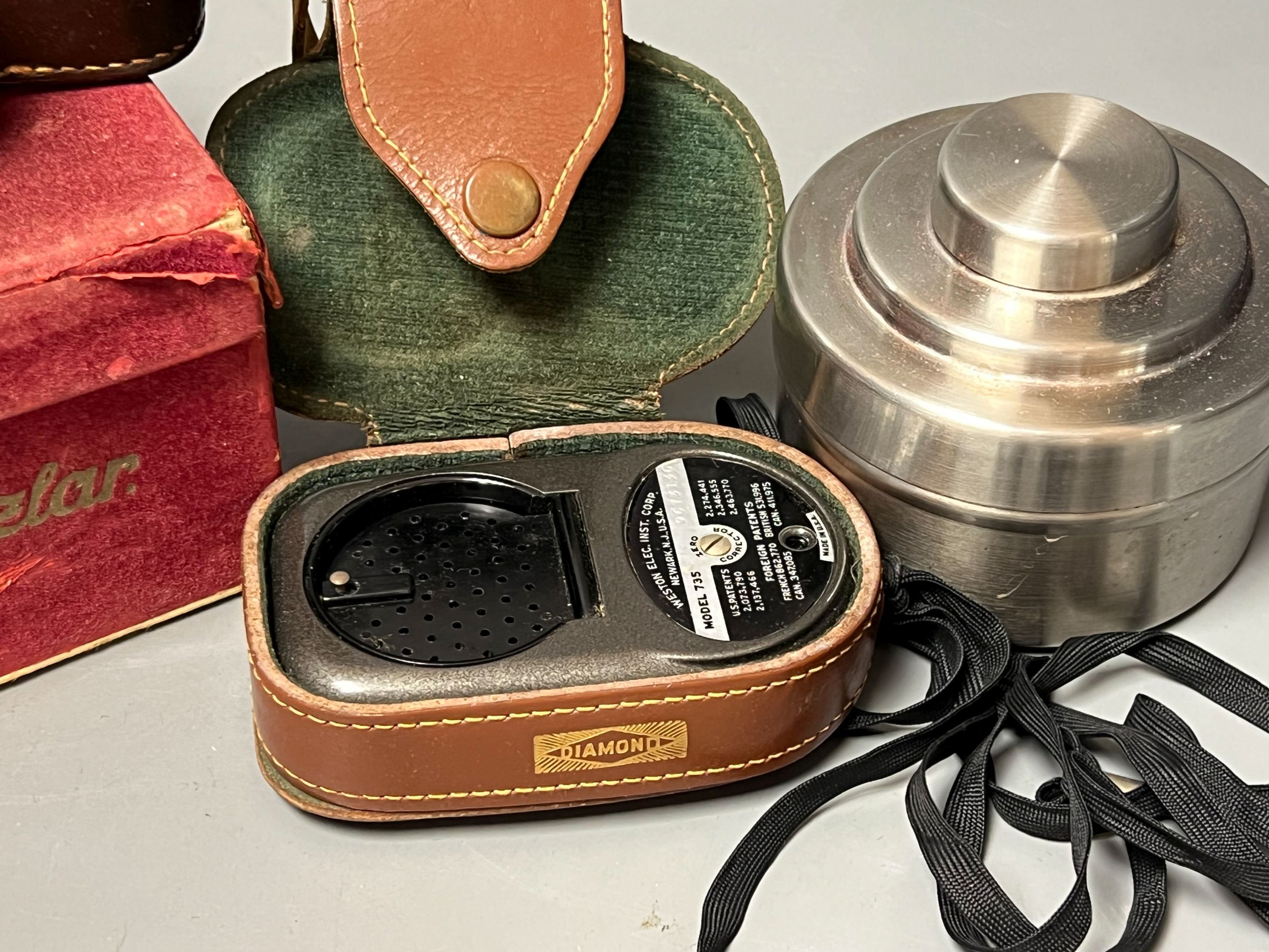 A cased Leica Ernst Leitz Wetzlar nr. 606583 camera together with light meter, lenses etc.